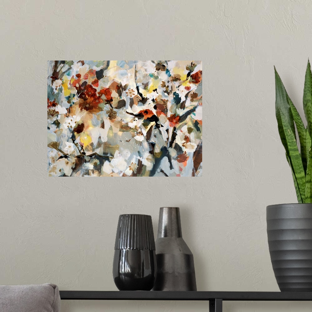 A modern room featuring Abstract painting of various types of flowers that are bunched together and uses soft colors.