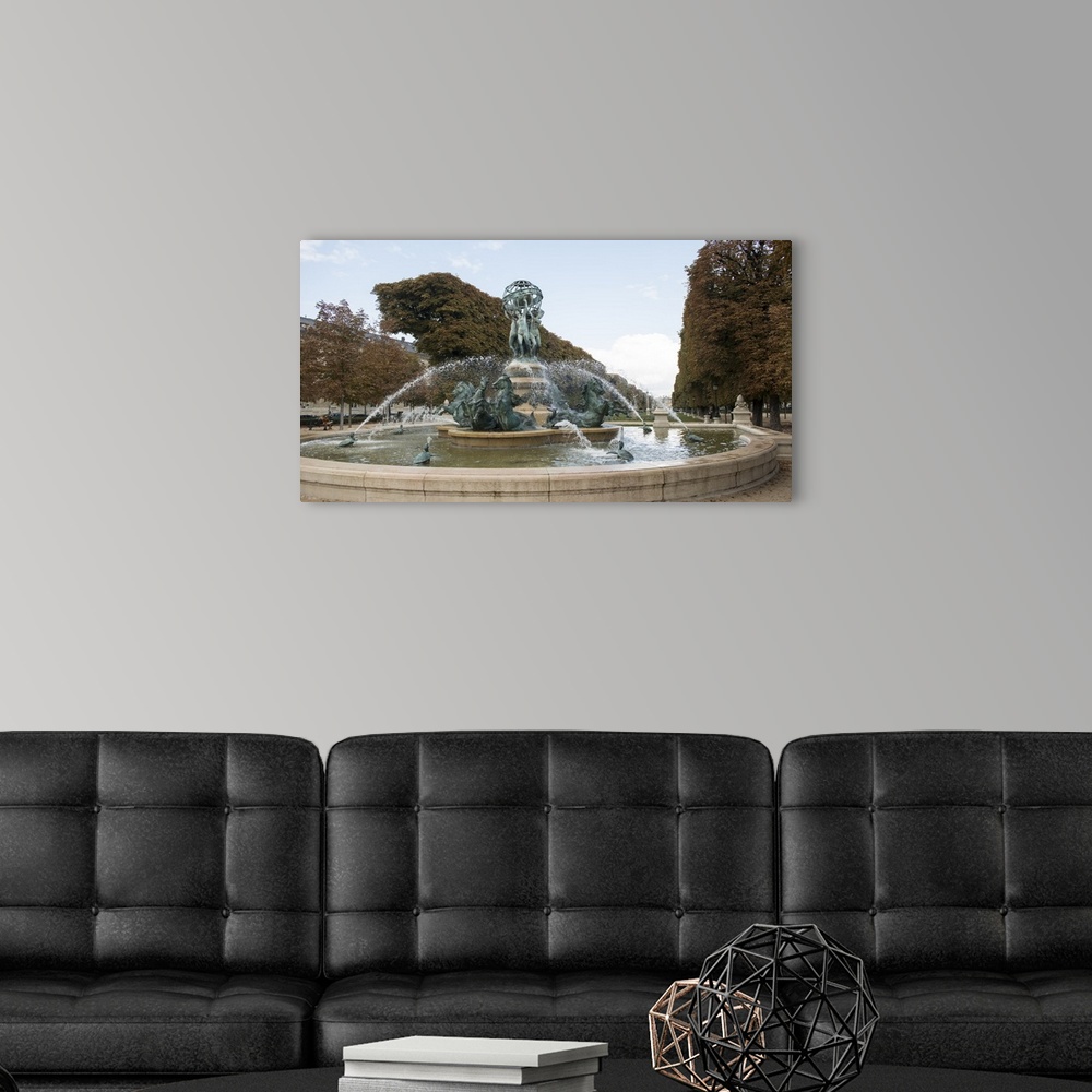 A modern room featuring Photograph of the Fountain Of The Observatory in Paris, France.