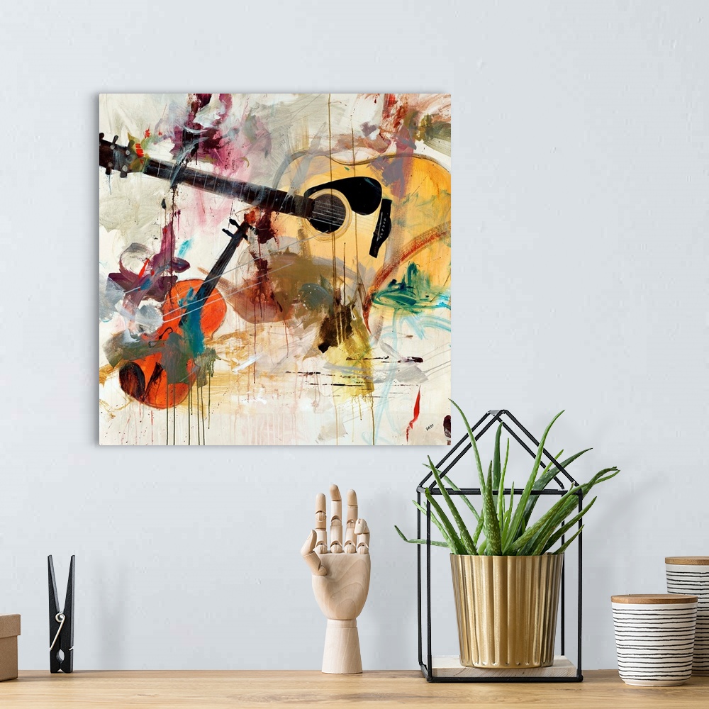 A bohemian room featuring Contemporary artwork of instruments with splashes of color painted over them.