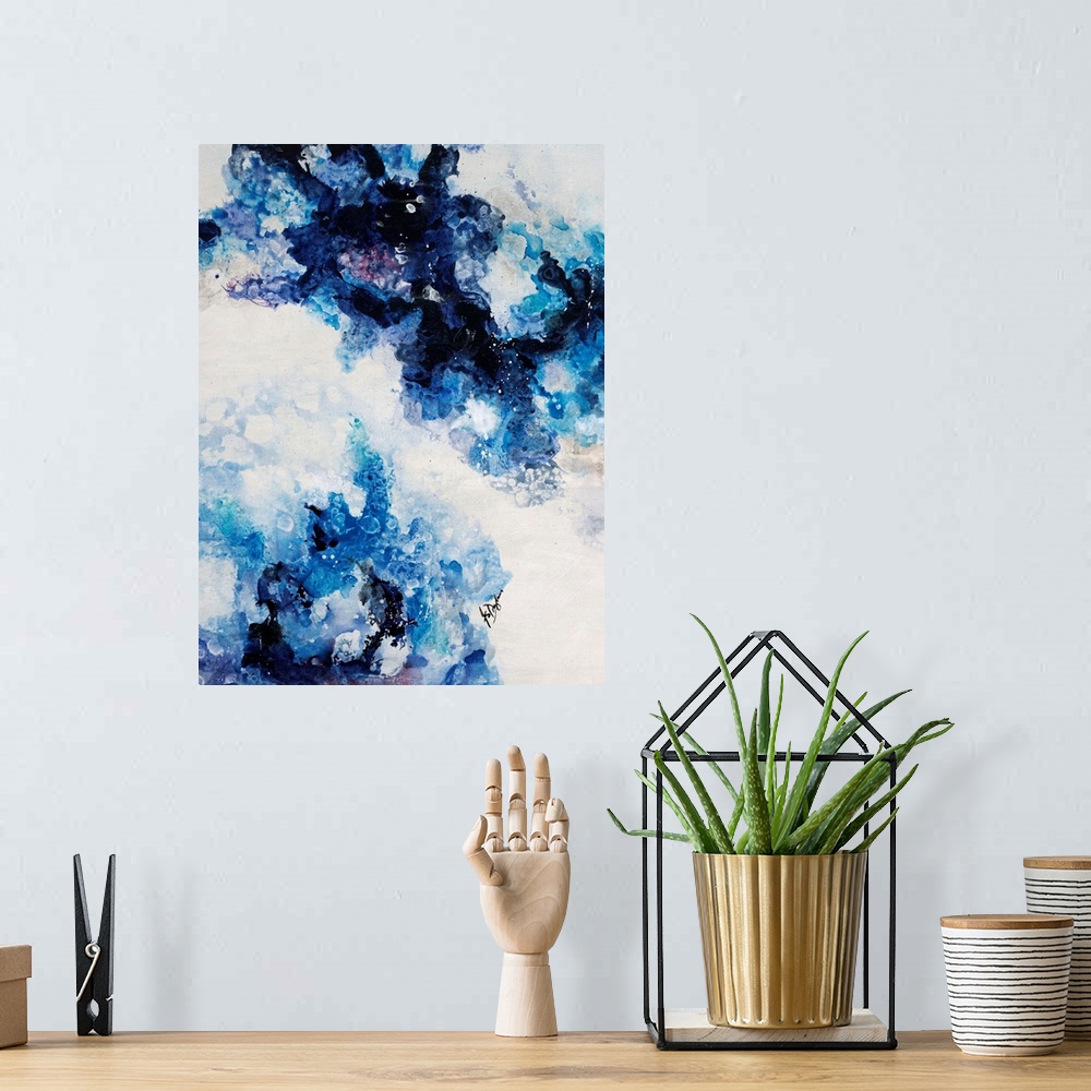 A bohemian room featuring Abstract painting of a mixture of varying blue tones swirling around against a neutral background.