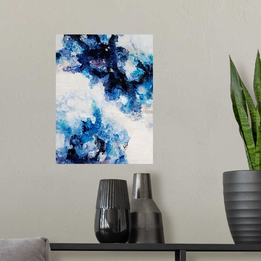 A modern room featuring Abstract painting of a mixture of varying blue tones swirling around against a neutral background.