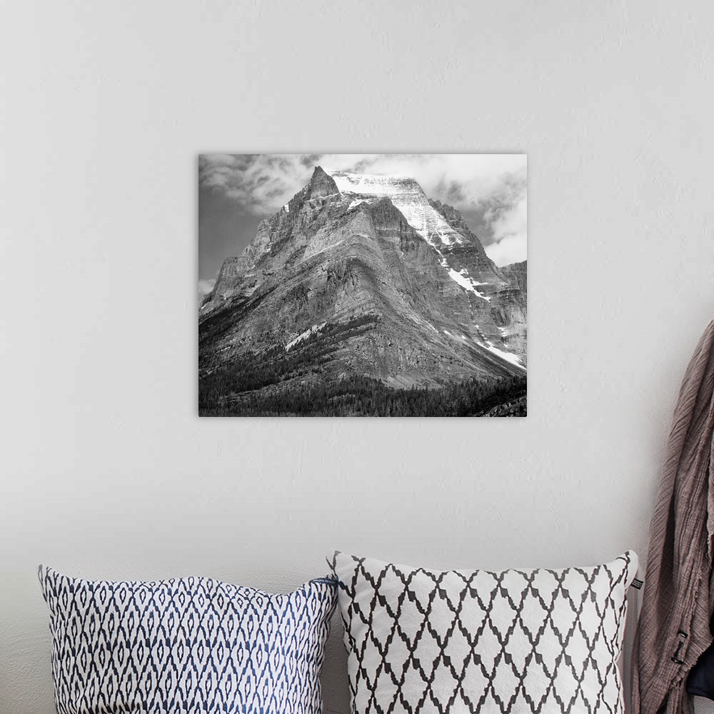 A bohemian room featuring Going-to-the-Sun Mountain, Glacier National Park, full view of mountain.