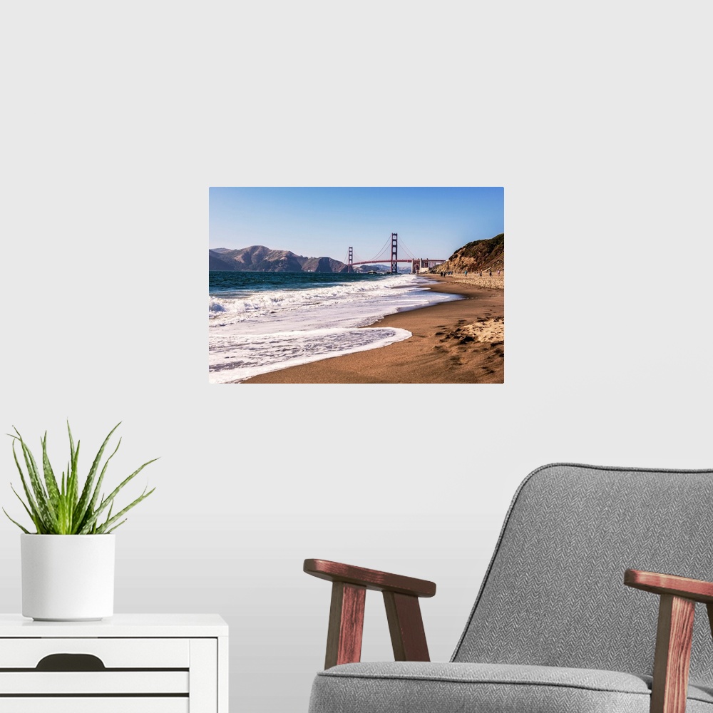 A modern room featuring Landscape photograph of a view of the Golden Gate Bridge from the pacific coast.