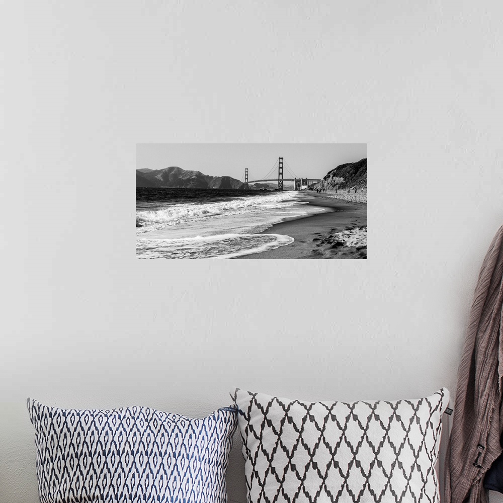 A bohemian room featuring Landscape photograph of a view of the Golden Gate Bridge from the pacific coast.