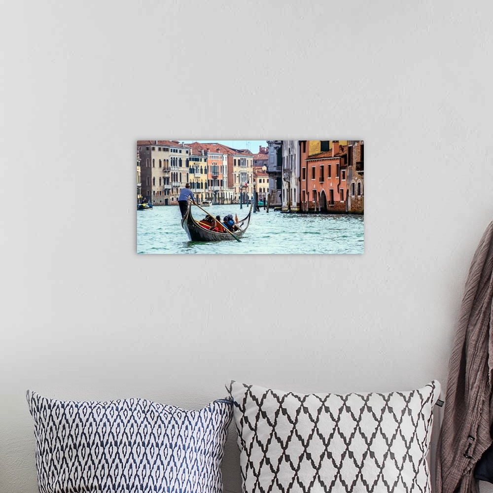 A bohemian room featuring Photograph of the rear side of a gondola rowing through Grand Canal in Venice.