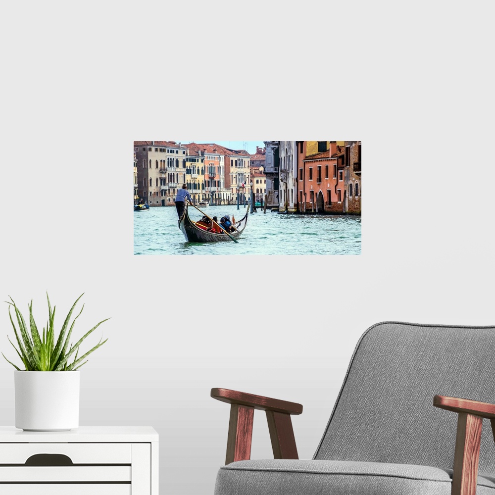 A modern room featuring Photograph of the rear side of a gondola rowing through Grand Canal in Venice.
