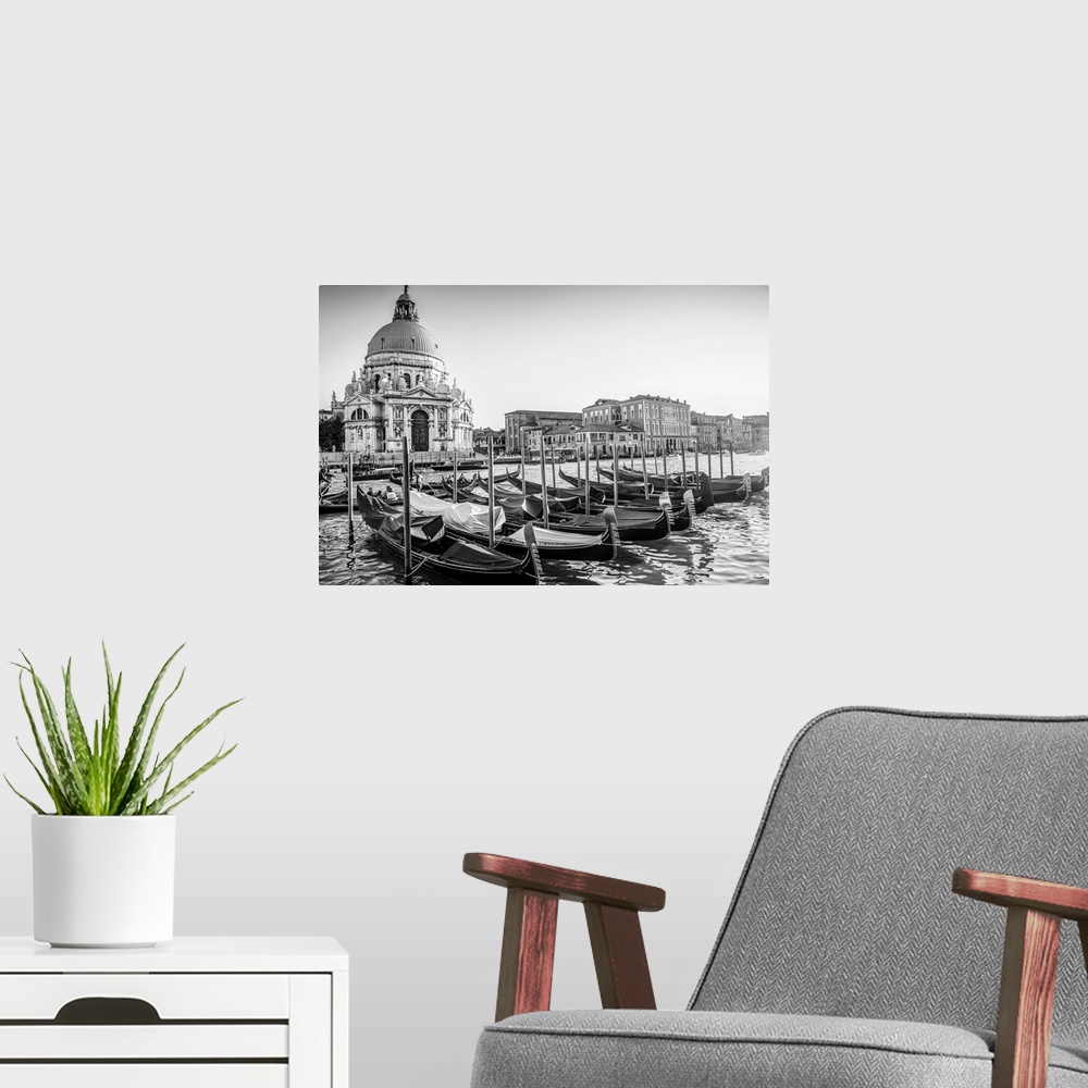 A modern room featuring Photograph of gondolas lined up in a row in front of Santa Maria della Salute, Venice, Italy, Eur...
