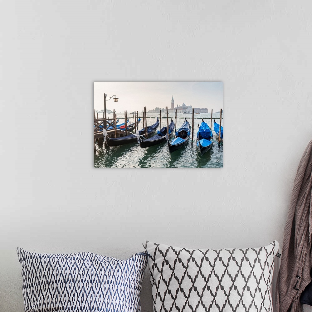 A bohemian room featuring Photograph of gondolas lined up in a row with St. Mark's Square (Piazza San Marco) in the backgro...