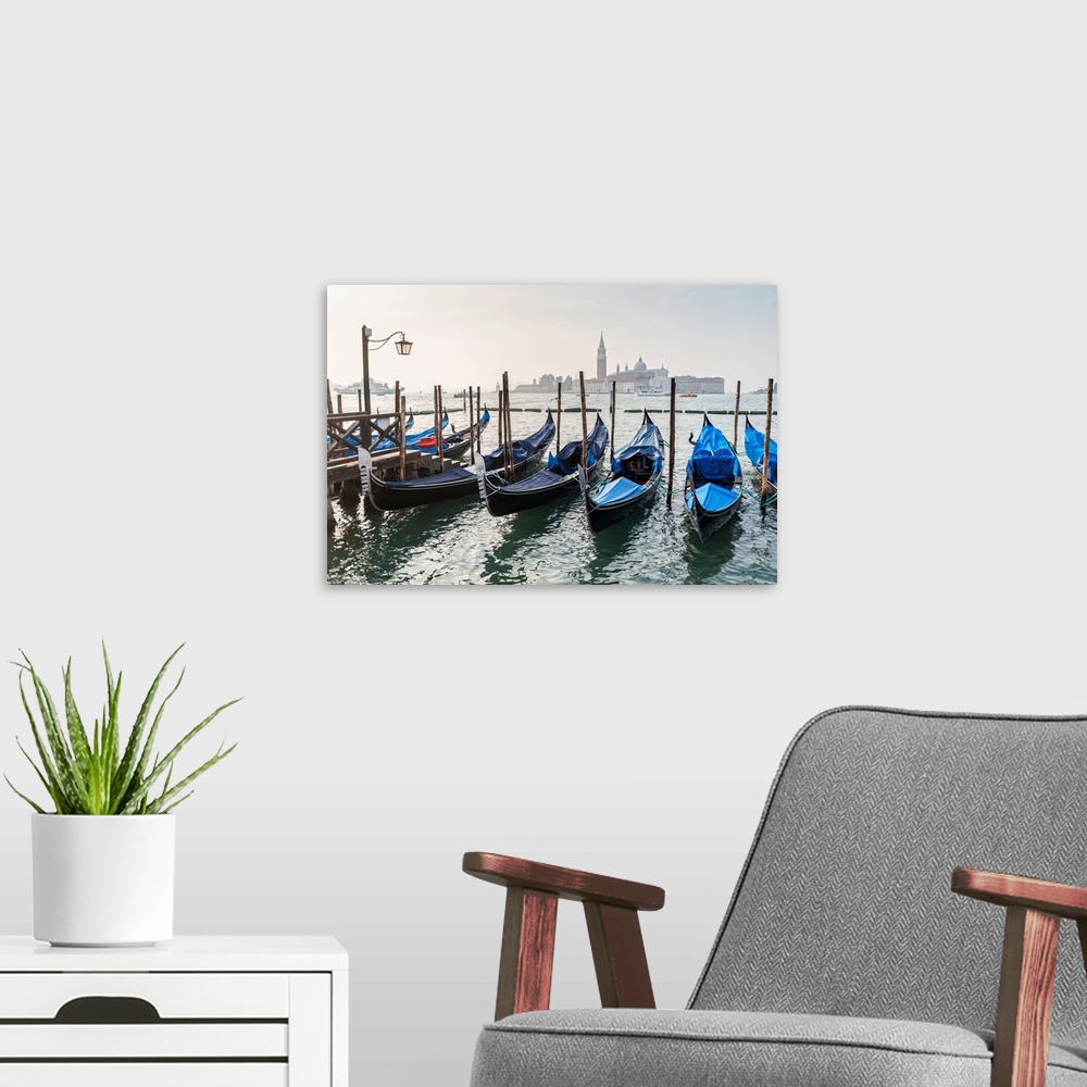 A modern room featuring Photograph of gondolas lined up in a row with St. Mark's Square (Piazza San Marco) in the backgro...
