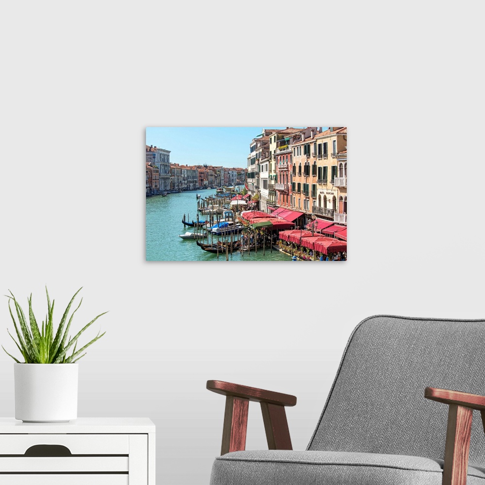 A modern room featuring Landscape photograph of buildings and gondolas on the Grand Canal in Venice.