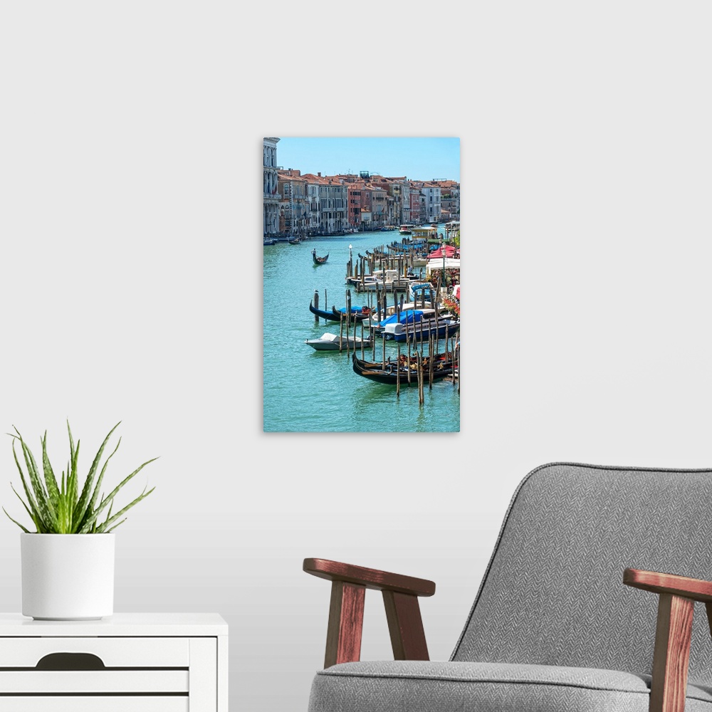 A modern room featuring Photograph of docked gondolas and boats on the Grand Canal in Venice.