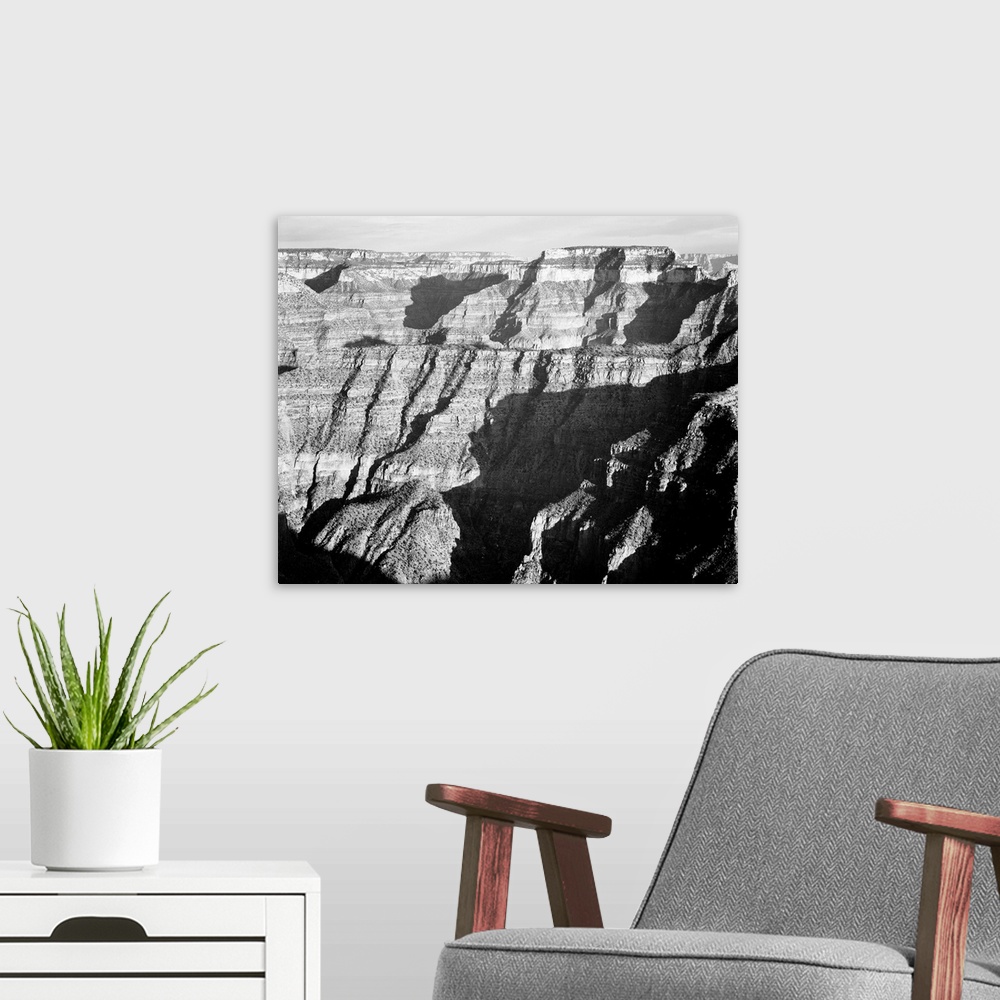 A modern room featuring Grand Canyon from N. Rim, 1941, closer view of cliff formation.