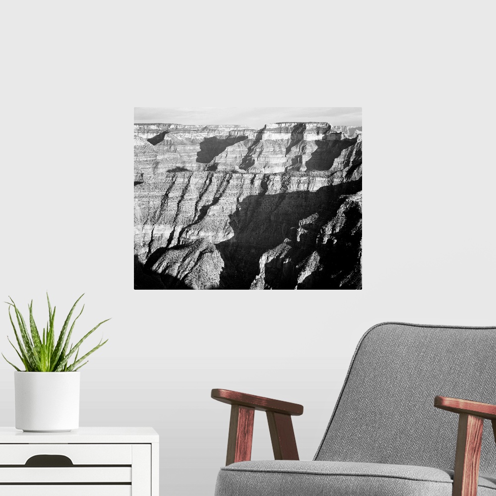 A modern room featuring Grand Canyon from N. Rim, 1941, closer view of cliff formation.