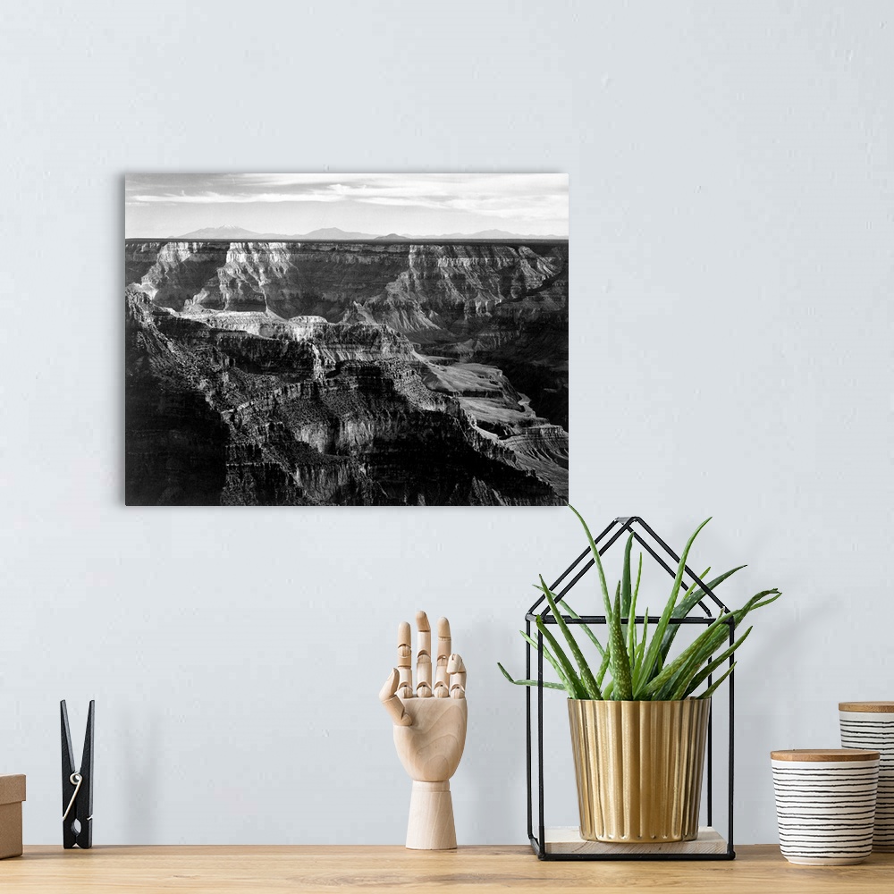 A bohemian room featuring Grand Canyon National Park, broad panorama with detail of canyon, horizon, and mountains above.