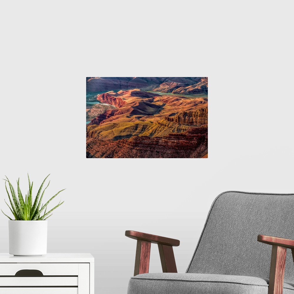 A modern room featuring Landscape photograph of the Colorado River winding through the Grand Canyon.