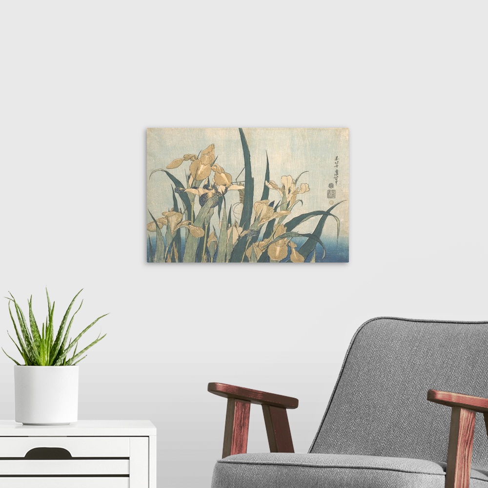 A modern room featuring Japanese woodblock print of a grasshopper hiding among yellow irises.