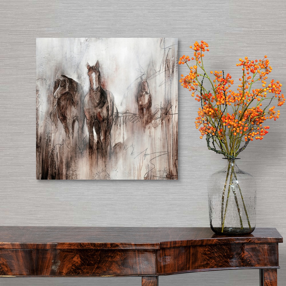 A traditional room featuring Artwork of three horses grazing together in a field of brown on an early foggy morning.