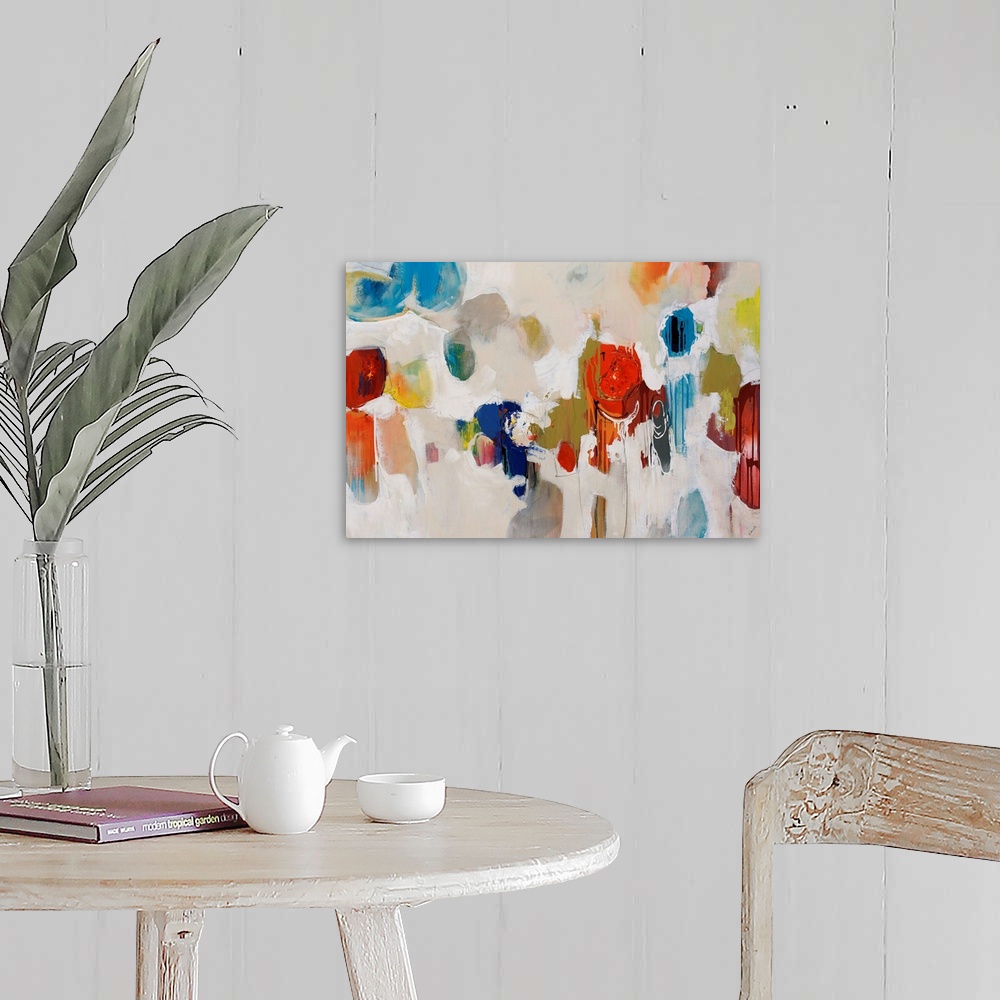 A farmhouse room featuring Big, colorful swirls of paint on this horizontal photograph of an abstract painting.