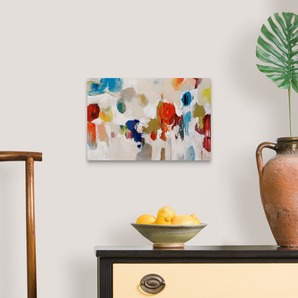 A traditional room featuring Big, colorful swirls of paint on this horizontal photograph of an abstract painting.