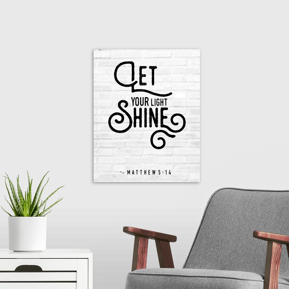 A modern room featuring A Bible Verse stating 'Let your Light Shine' in a modern black font against a faux white brick ba...
