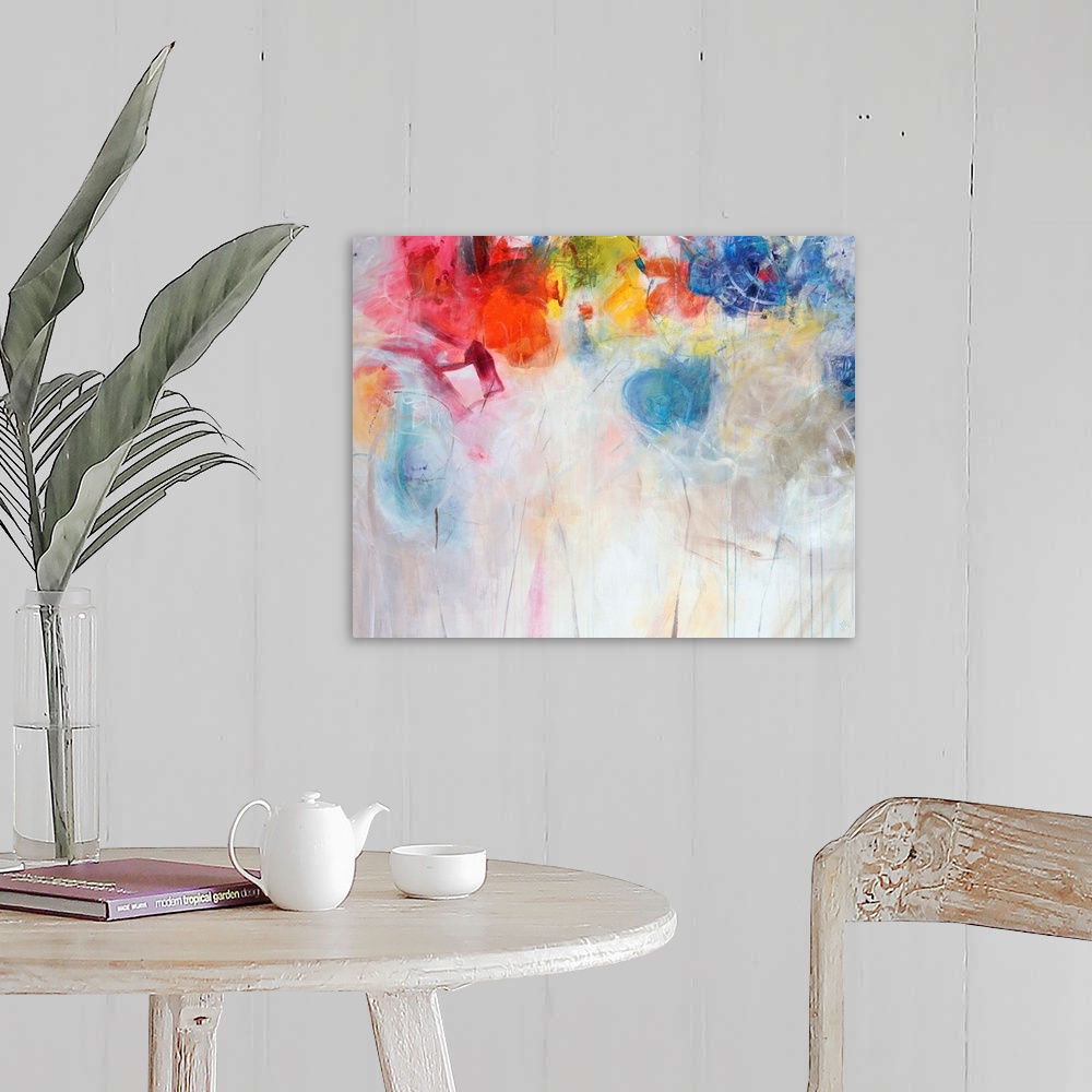 A farmhouse room featuring Contemporary abstract painting of bright multi-colored forms overtop a neutral background.