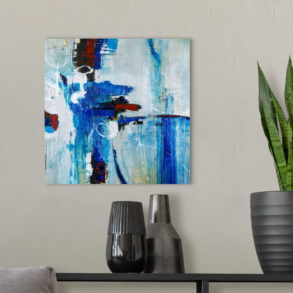 A modern room featuring Abstract painting of bright blue brustrokes against a gray-blue background.