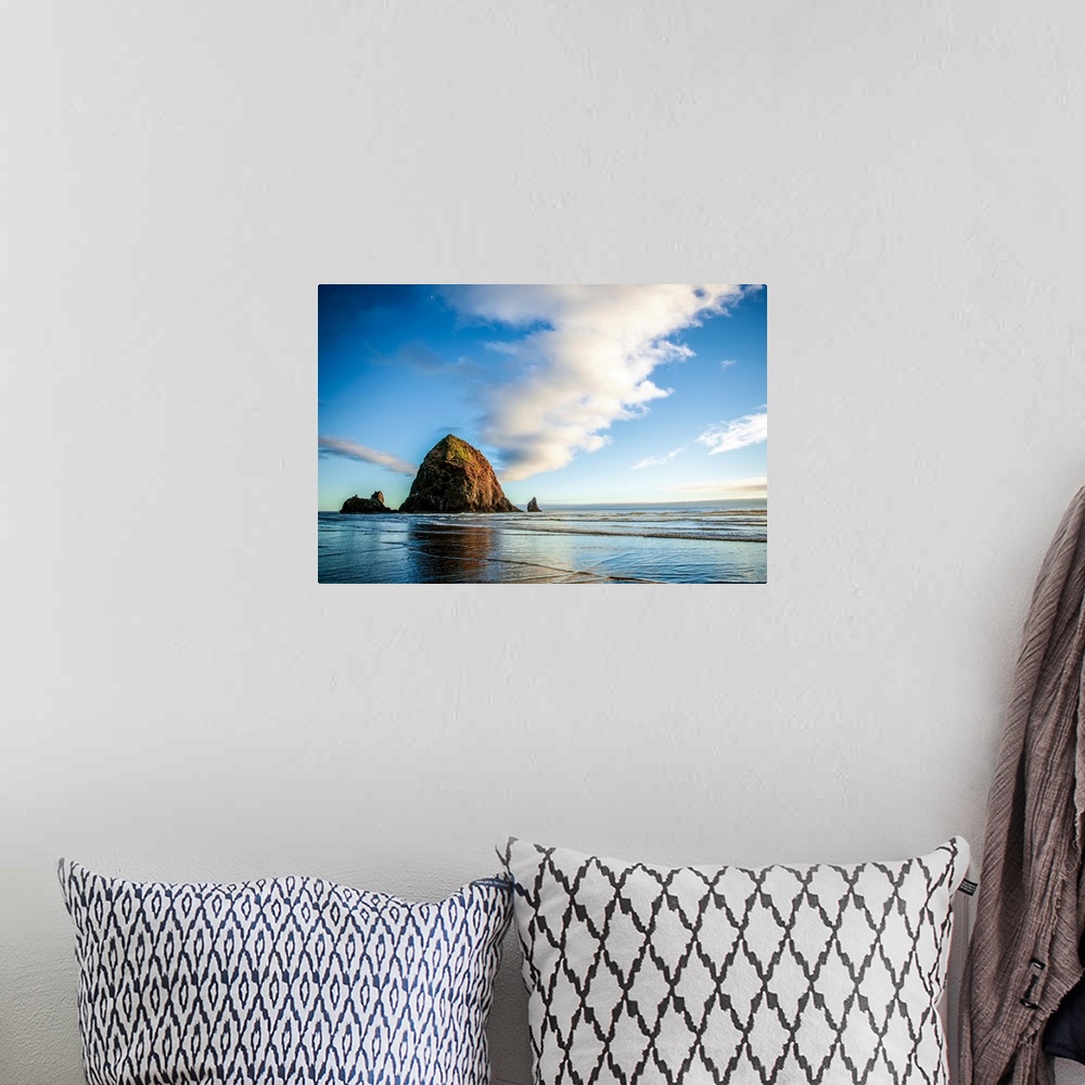 A bohemian room featuring Panoramic photograph of Haystack Rock at golden hour, just before sunset, Cannon Beach, Oregon.