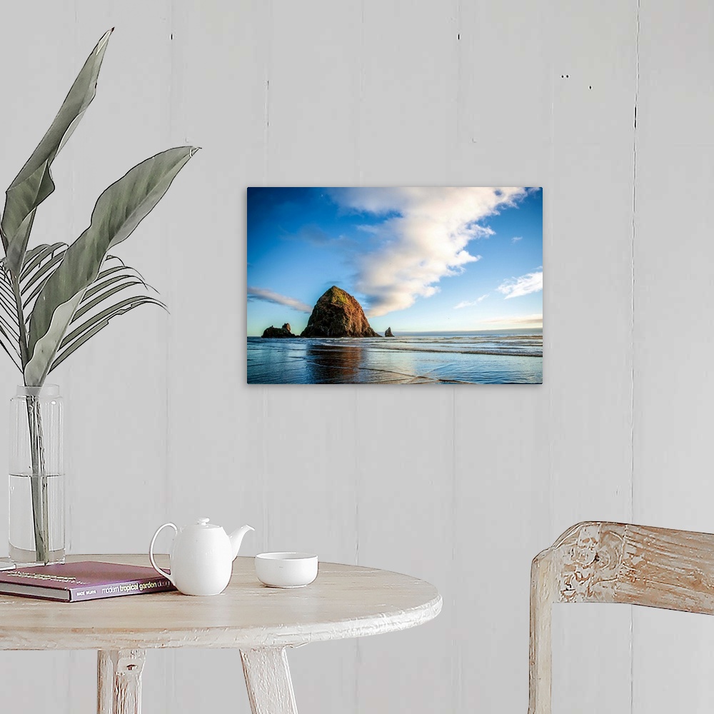A farmhouse room featuring Photograph of Haystack Rock at golden hour just before sunset.