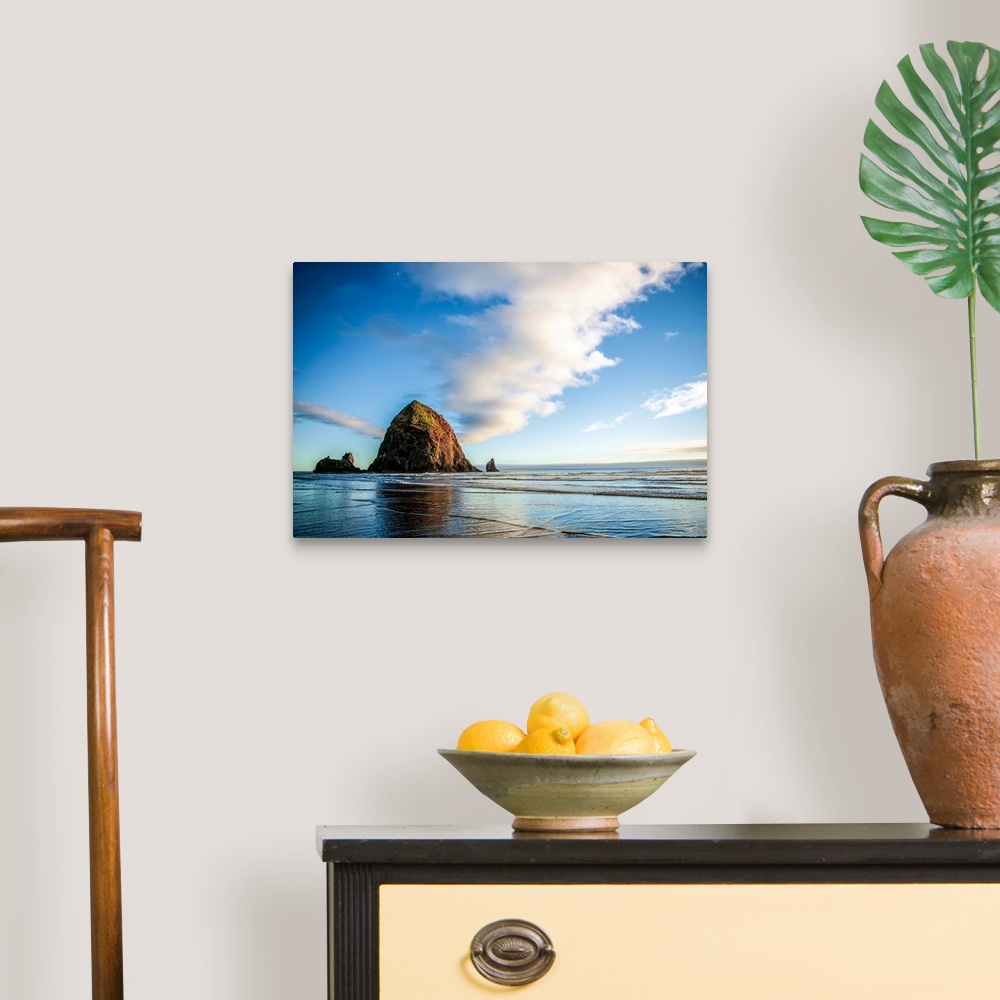 A traditional room featuring Photograph of Haystack Rock at golden hour just before sunset.