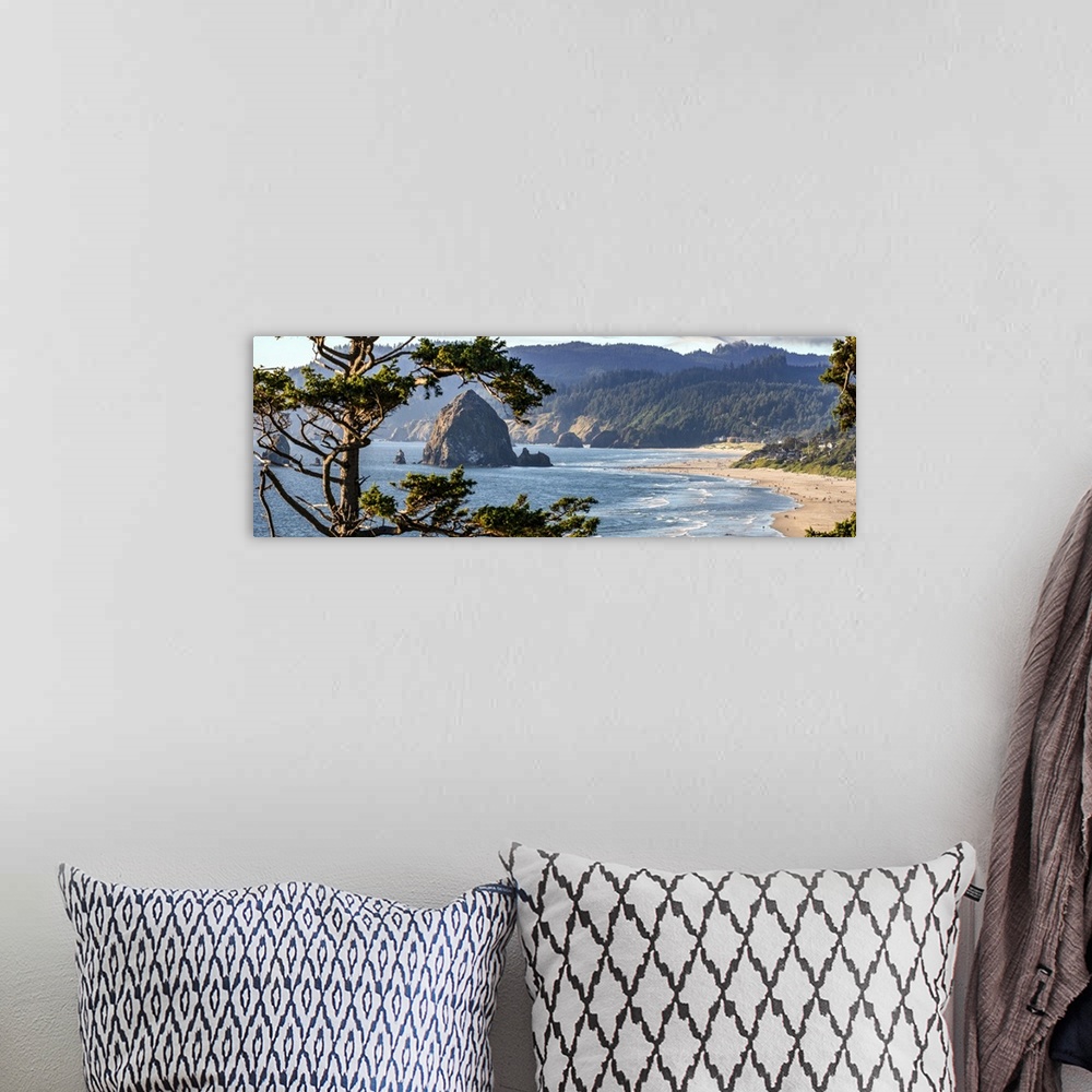 A bohemian room featuring Landscape photograph of Cannon Beach through the trees with Haystack Rock in the distance, Oregon...