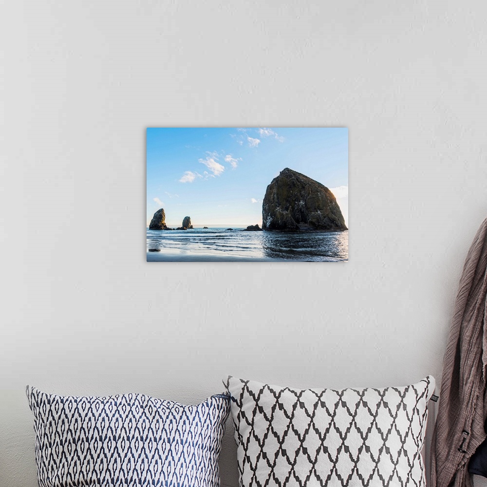 A bohemian room featuring Photograph of Haystack Rock at Cannon Beach with blue skies.