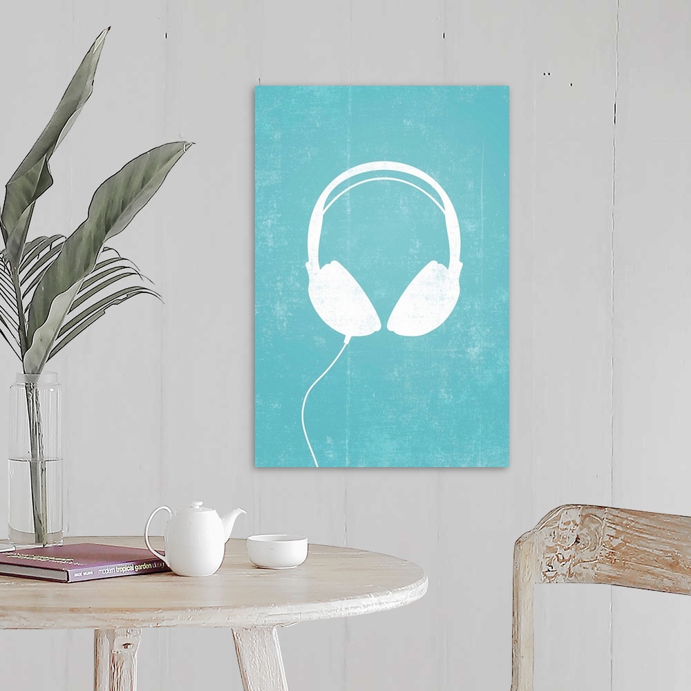 A farmhouse room featuring Giant, vertical retro art of a white silhouette of a pair of headphones with a thin cord attached...