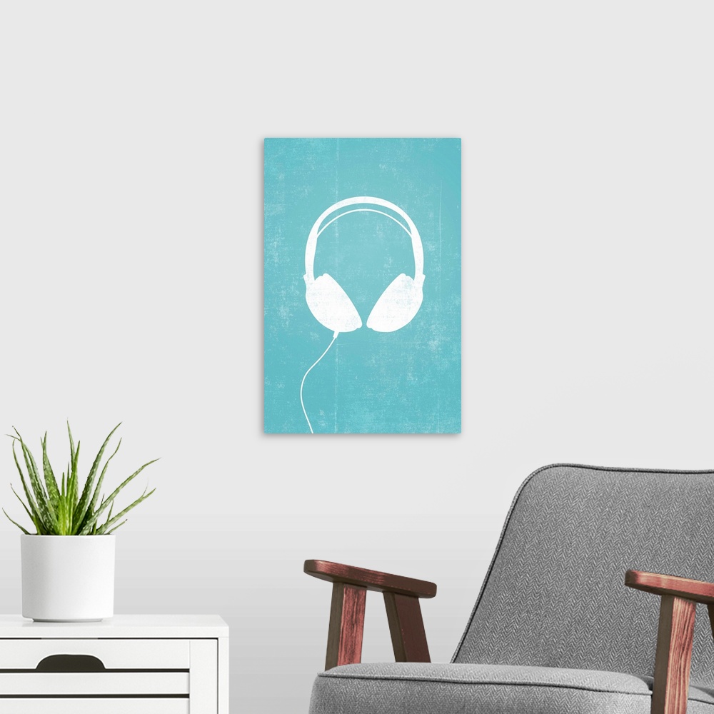 A modern room featuring Giant, vertical retro art of a white silhouette of a pair of headphones with a thin cord attached...
