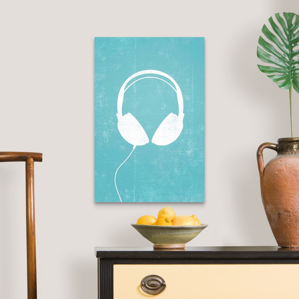 A traditional room featuring Giant, vertical retro art of a white silhouette of a pair of headphones with a thin cord attached...
