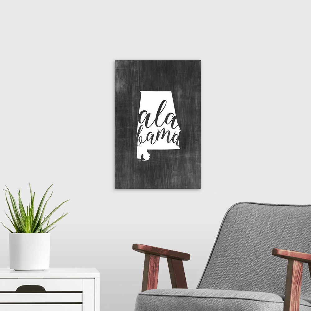 A modern room featuring Alabama state outline typography artwork.