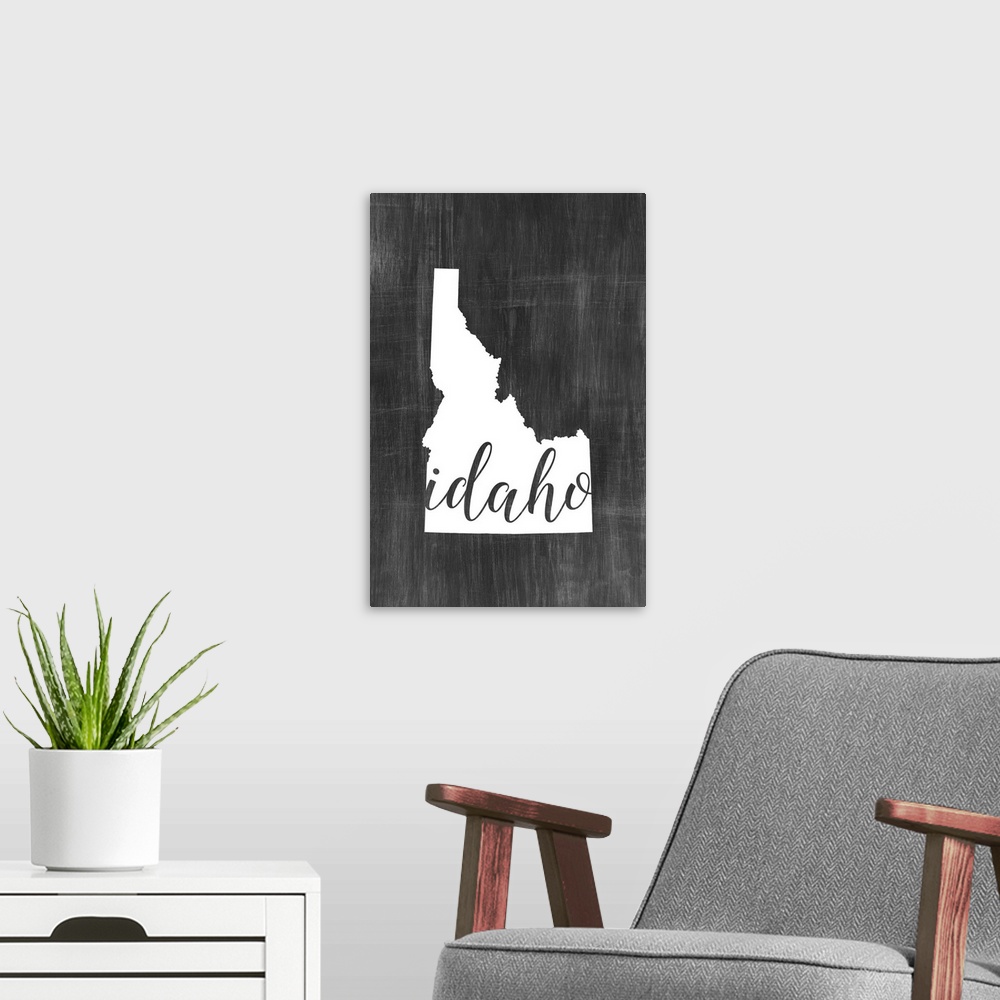 A modern room featuring Idaho state outline typography artwork.