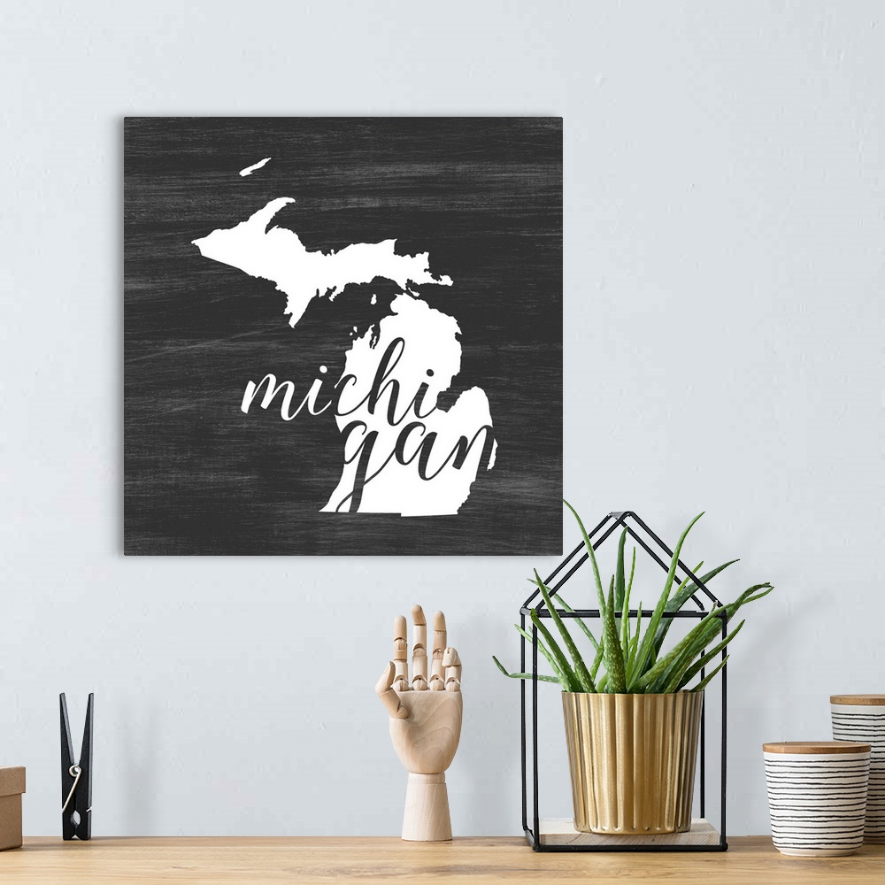 A bohemian room featuring Michigan state outline typography artwork.