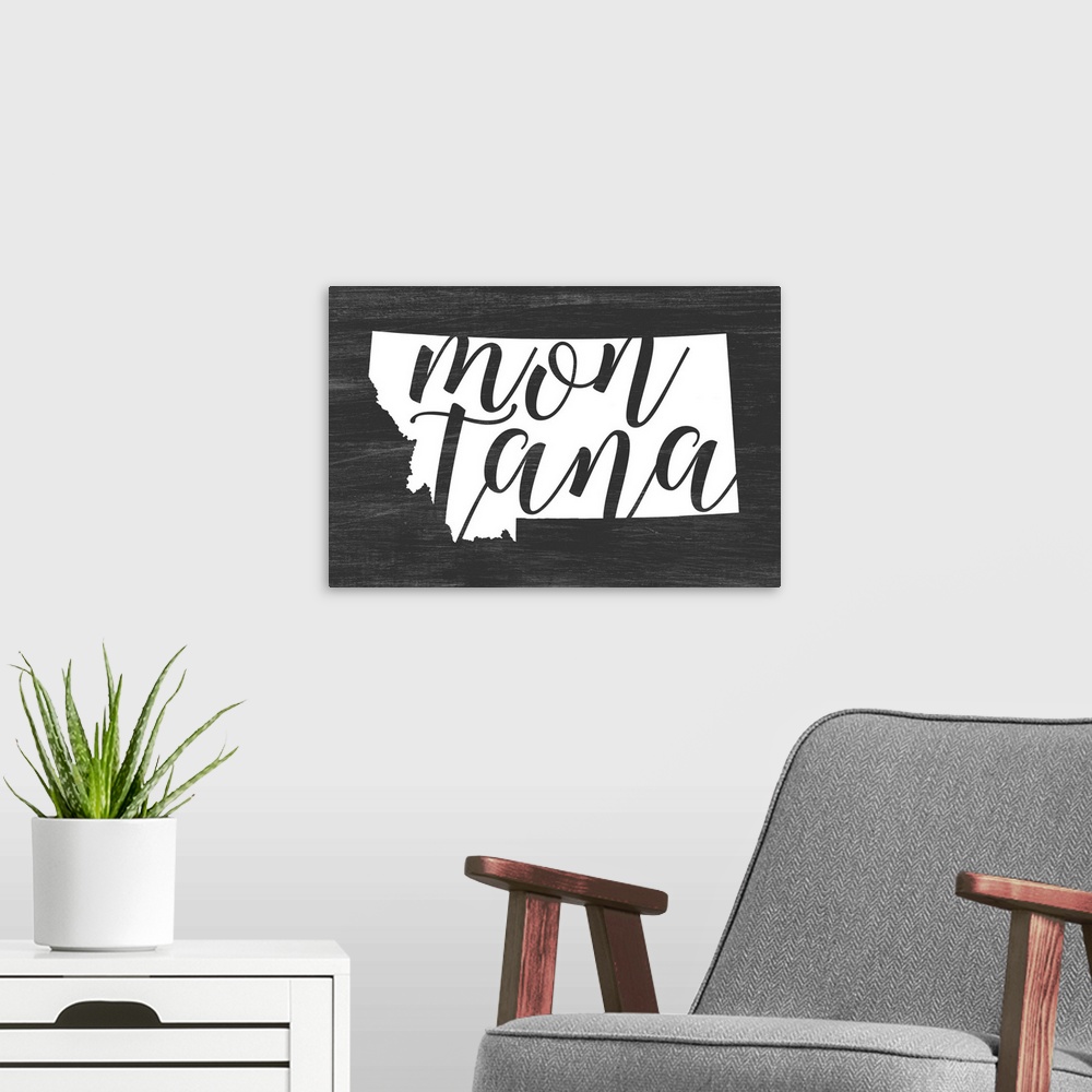A modern room featuring Montana state outline typography artwork.