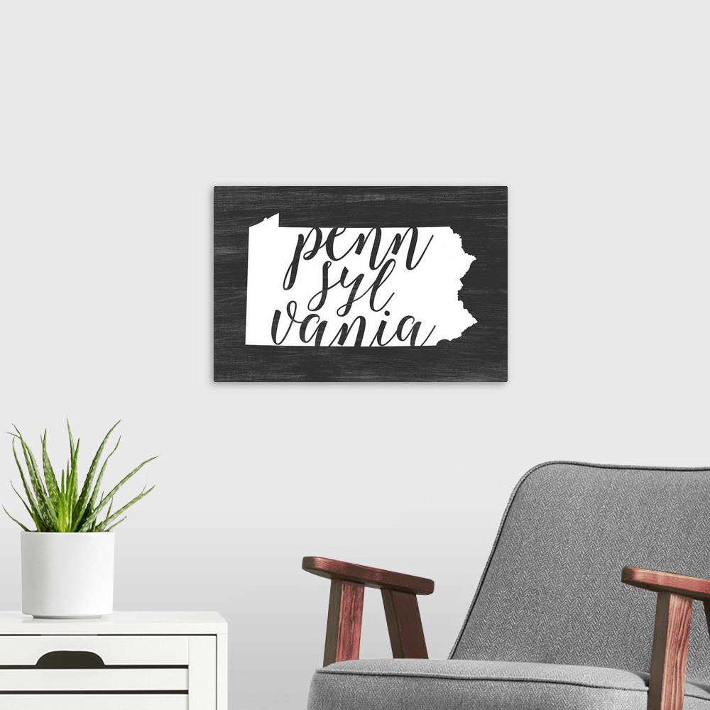 A modern room featuring Pennsylvania state outline typography artwork.