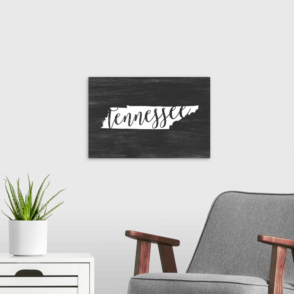 A modern room featuring Tennessee state outline typography artwork.