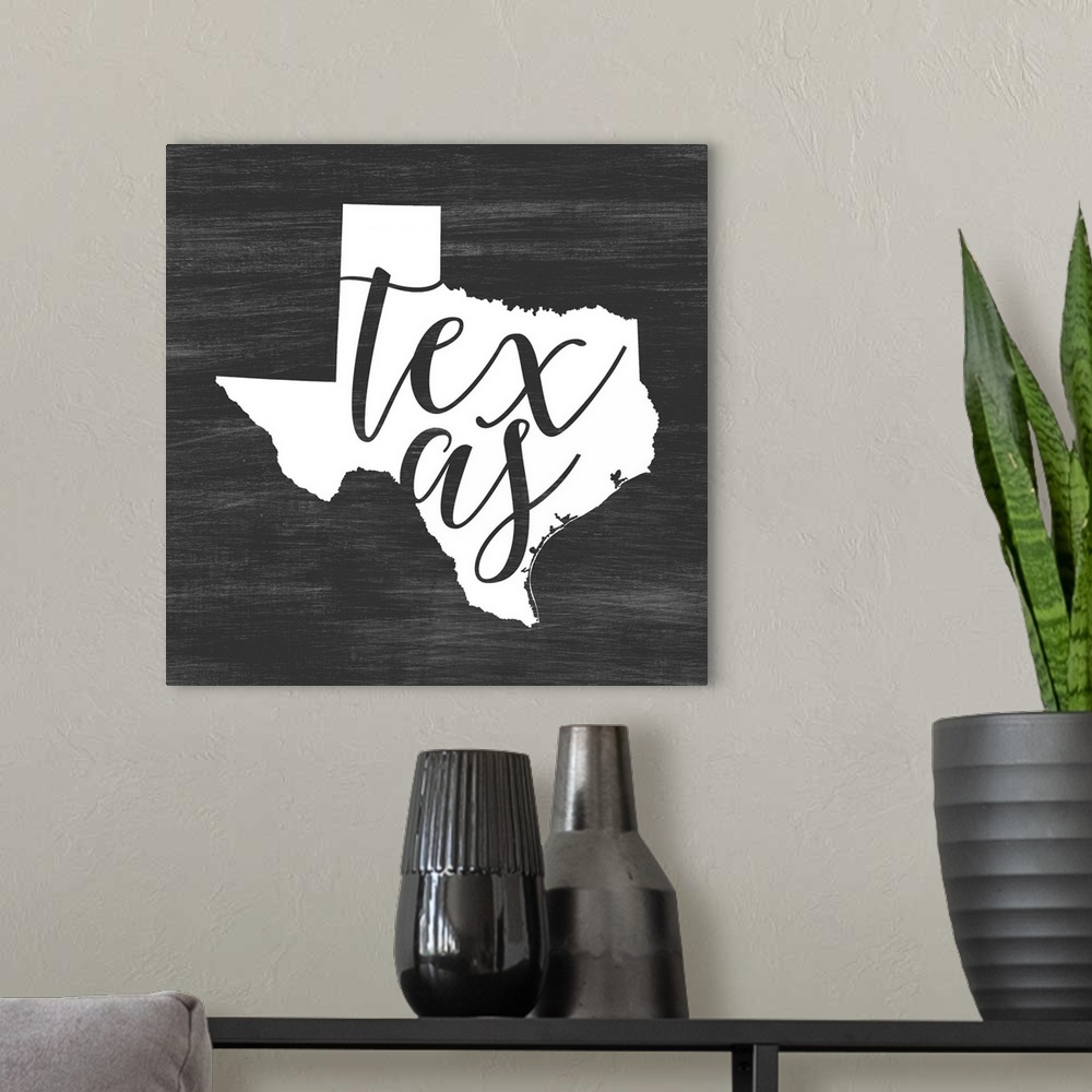 A modern room featuring Texas state outline typography artwork.