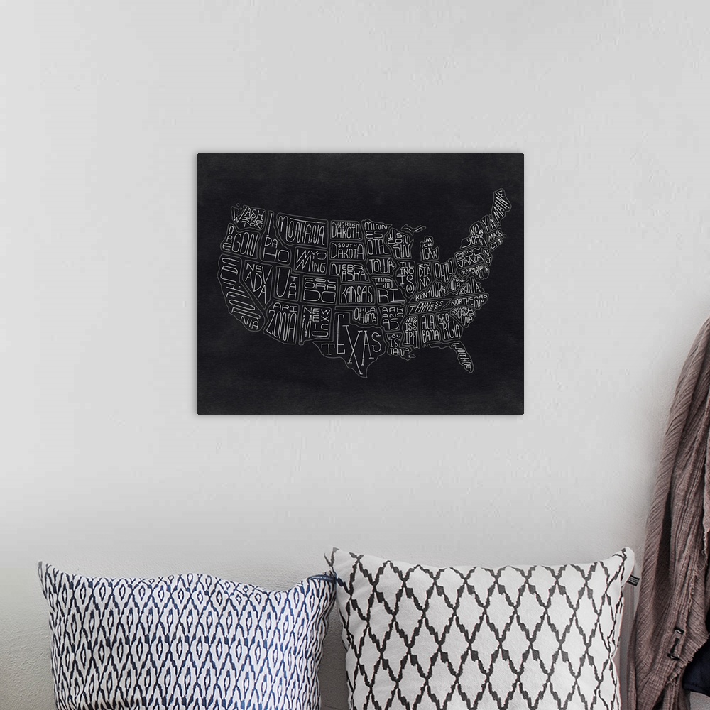 A bohemian room featuring Continental map of the United States with the names of the states in a handwritten style.