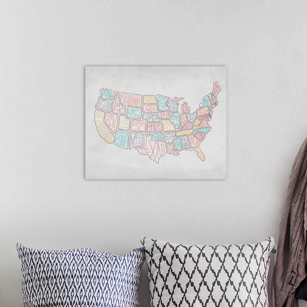 A bohemian room featuring Continental map of the United States with the names of the states in a handwritten style.