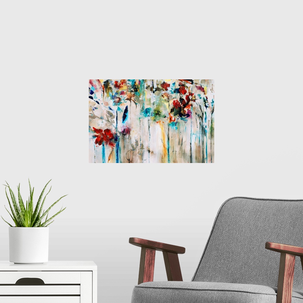 A modern room featuring Abstracted painting of flowers done in brilliant colors set against a neutral background.