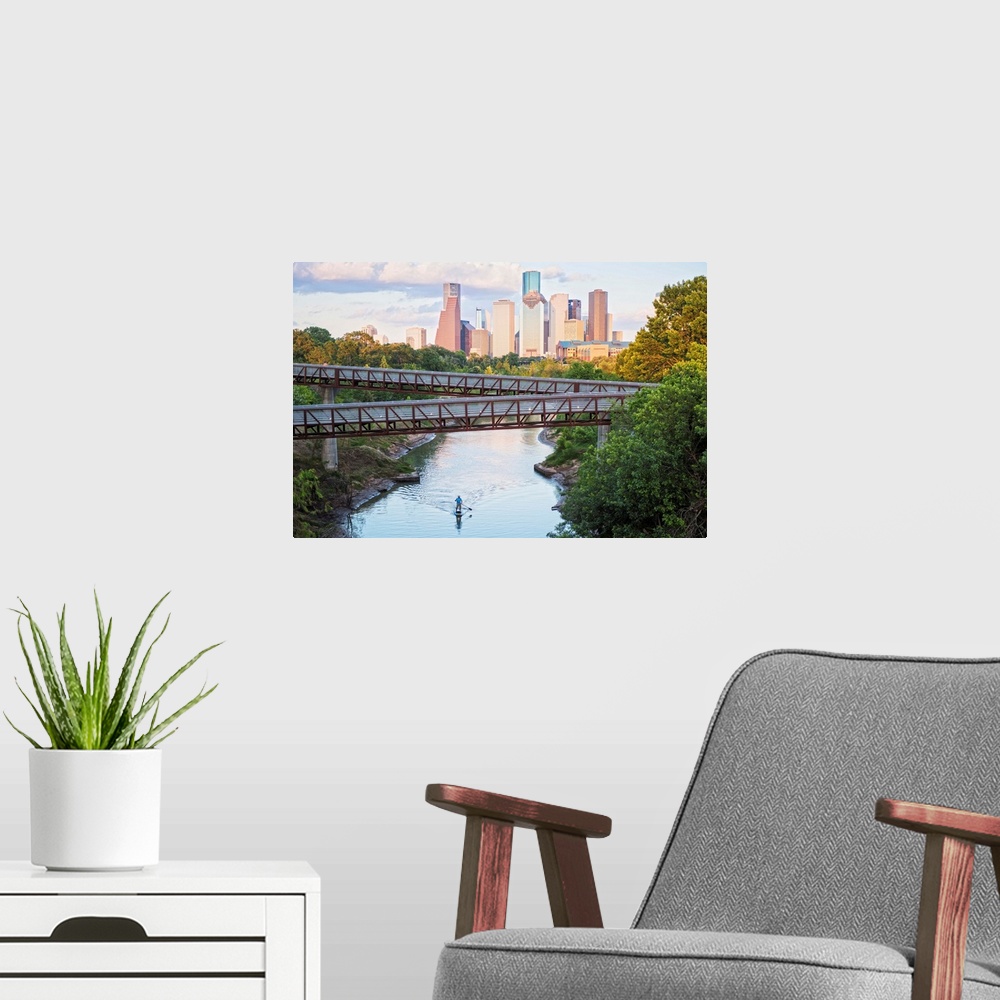 A modern room featuring Photograph of the Houston TX skyline in the distance with the  Rosemont pedestrian bridge in the ...