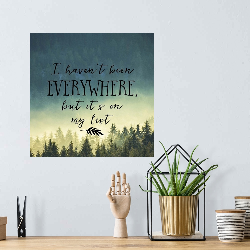 A bohemian room featuring Handwritten message about adventure and travel, over an image of a misty pine forest.