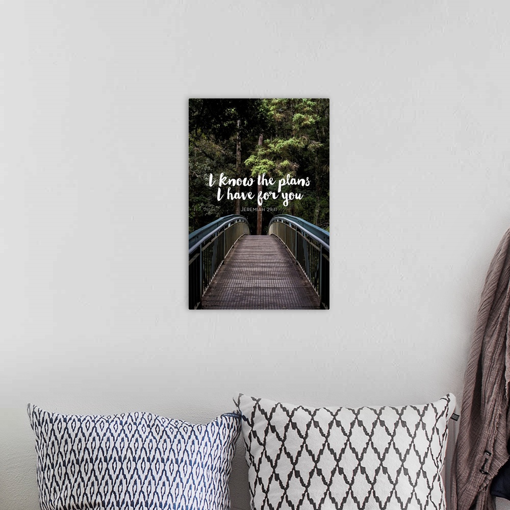 A bohemian room featuring Typography art of a bible verse from Jeremiah 29:11 over an image of a bridge in a forest.