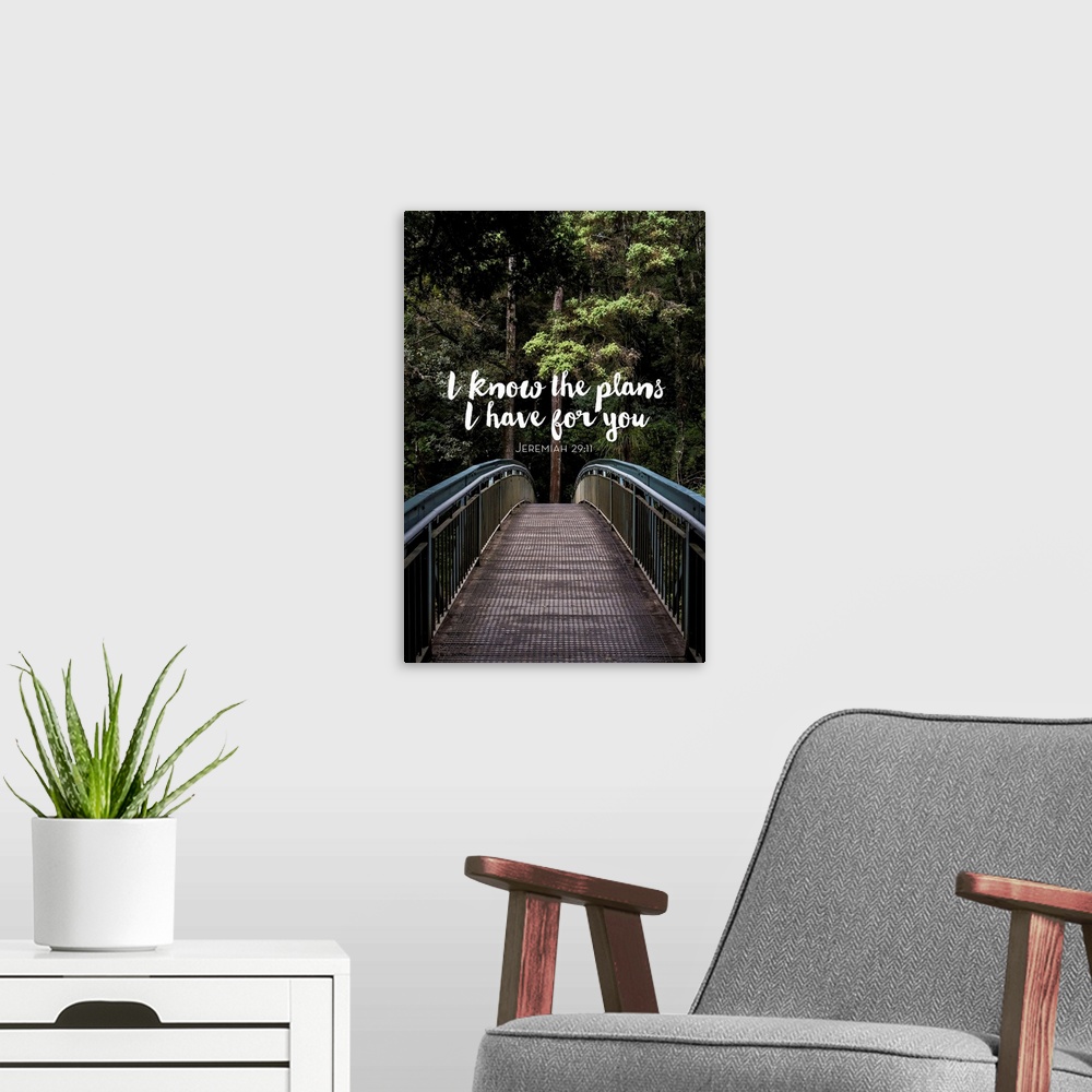 A modern room featuring Typography art of a bible verse from Jeremiah 29:11 over an image of a bridge in a forest.