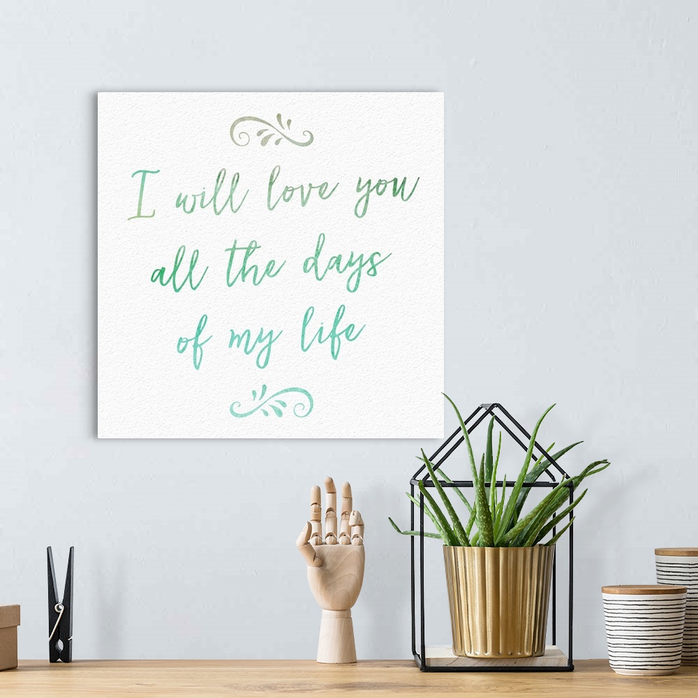 A bohemian room featuring "I will love you all the days of my life" handwritten in blue and green shades.