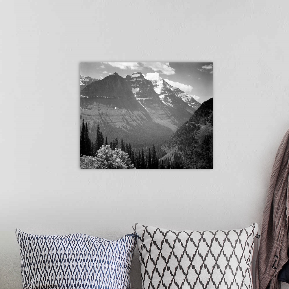 A bohemian room featuring In Glacier National Park, valley, snow covered mountains in background.
